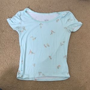 Blue top with flowers, a little short but stretchy material. From kohl’s.